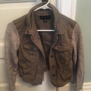 Dark green jacket with gray sweatshirt sleeves